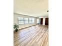Bright living room showcasing sleek flooring and plentiful windows for natural light at 10529 Se 50Th Ave, Belleview, FL 34420