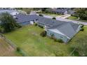 Aerial view of a home with a large, grassy backyard, surrounded by a chain-link fence for privacy and security at 4514 Crichton Ln, Orlando, FL 32806