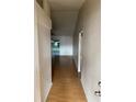 Bright hallway features wood-look flooring and leads to the living area at 6616 Shepherd Oaks St, Lakeland, FL 33811
