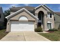 Charming two-story stucco home with a two-car garage and well-maintained landscaping at 904 W Charing Cross Cir, Lake Mary, FL 32746