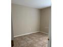 A cozy bedroom with tiled floors and neutral paint, ready for personalization at 2470 Augusta Way, Kissimmee, FL 34746