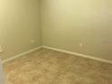 Neutral bedroom with tile flooring, offering a clean and simple design at 2470 Augusta Way, Kissimmee, FL 34746
