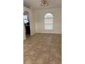 A bright living room features tiled floors and a window offering natural light at 2470 Augusta Way, Kissimmee, FL 34746