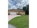Home with a spacious two-car garage and brick-paved driveway at 2913 Deerbrook Dr, Lakeland, FL 33811