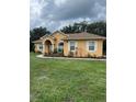 Beautiful home boasts a brick-lined walkway and manicured landscaping at 2913 Deerbrook Dr, Lakeland, FL 33811
