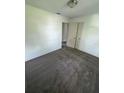 Cozy bedroom featuring plush gray carpeting, white walls, and a convenient closet at 2921 Crutchfield W Rd, Lakeland, FL 33805