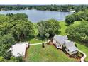 Expansive property with a beautiful home, lush greenery, and stunning lake views, ideal for outdoor living at 3450 Ohio Ave, Sanford, FL 32773