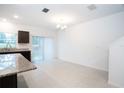 Open-concept dining area with sliding glass doors leading to outdoor space at 3850 Hampstead Ln, Lakeland, FL 33810