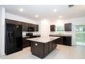 Modern kitchen featuring granite countertops, stainless steel appliances and an island at 3850 Hampstead Ln, Lakeland, FL 33810