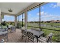 Covered patio with comfortable seating, perfect for enjoying the outdoor view at 3869 Shoreside Dr, Kissimmee, FL 34746