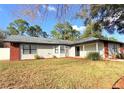 Well-maintained single-Gathering home featuring a classic design and neatly trimmed lawn at 5703 Sw 108Th St, Ocala, FL 34476