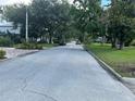 Quiet residential street with mature trees and well-maintained landscaping at 907 N Hyer Ave, Orlando, FL 32803