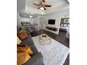 Inviting living area with a stylish rug, open to a modern kitchen and connected to the main bedroom at 1310 Seven Eagles Ct # 102, Reunion, FL 34747
