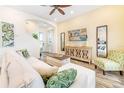 Living room with L-shaped sofa, TV, and decorative wooden cabinet at 2968 Salted Rim Rd, Kissimmee, FL 34747