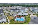 Community pool and surrounding neighborhood view at 7401 Levee Ln, Celebration, FL 34747