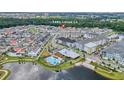 Community overview showcasing homes, pool, and lake at 7401 Levee Ln, Celebration, FL 34747