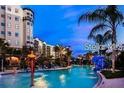 Large pool with a splash pad area at 14501 Grove Resort Ave # 1637, Winter Garden, FL 34787