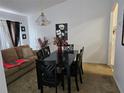 Nicely decorated dining room with black dining set next to the living room at 959 Nancy Ct, Kissimmee, FL 34759