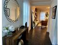 Bright entryway with wood console table and large mirror at 2755 Monticello Way, Kissimmee, FL 34741