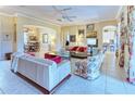 Inviting living room features neutral colors, tile flooring, and abundant natural light at 441 Mayfair Dr, Kissimmee, FL 34759