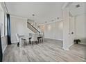 Bright dining room with tile floors, chandelier, and seating for four at 507 Natural Bridge Ct, Apopka, FL 32703