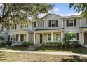 Inviting townhouse with a cozy front porch, perfect for enjoying the outdoors at 13712 Summerport Village Pkwy, Windermere, FL 34786