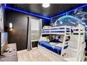 Themed ' bedroom featuring a bunk bed, themed wallpaper, and carpet flooring at 4348 Quote St, Kissimmee, FL 34746