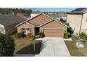 Two-story house with a driveway and landscaping at 405 Briar Patch Loop, Davenport, FL 33896