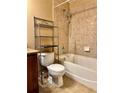 This bathroom features a shower-tub combo with tiled walls, perfect for relaxation and convenience at 2680 Mayaguana St, Kissimmee, FL 34747