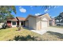 Inviting single-Gathering home with a well-kept lawn and a two-car garage, perfect for comfortable living at 5317 Micco St, Kissimmee, FL 34746