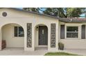 Renovated entryway with arched details and a modern door at 4401 Marshall St, Orlando, FL 32811