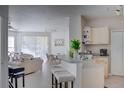 Cozy living room features an open floor plan with kitchen breakfast bar and lots of natural light at 1100 Lake Shadow Cir # 2101, Maitland, FL 32751