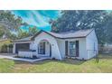 A delightful home featuring an arched entryway, nice landscaping and a cozy front lawn at 2220 Crystal Grove Ln, Lakeland, FL 33801