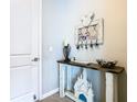 Entryway with console table and Disney decor at 592 Lake Smart Blvd, Winter Haven, FL 33881