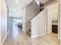 Bright hallway with tile floors and staircase at 592 Lake Smart Blvd, Winter Haven, FL 33881