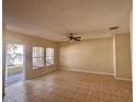 Bright living room with tile floors and sliding glass doors leading to backyard at 2060 Cypress Bay Blvd, Kissimmee, FL 34743