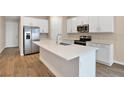 Modern kitchen with stainless steel appliances and an island at 3345 Chicory Ct, Lake Hamilton, FL 33851