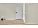 Clean entryway with tile transition, offering a welcoming transition to the home at 3145 Britannia Blvd # D, Kissimmee, FL 34747