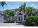 Beautiful single-story home with brick driveway, lush landscaping, and double door entry at 14421 Hatchee Ct, Orlando, FL 32837