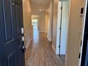 Inviting home hallway with tile flooring leading to an open living space and outdoor views at 1077 Quaker Ridge Ln, Davenport, FL 33896