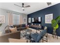 Spacious living room with a large TV and comfortable seating at 331 Ballo Dr, Kissimmee, FL 34746