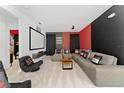 Home theater with sectional sofa and large projector screen at 331 Ballo Dr, Kissimmee, FL 34746