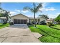 Charming single-story home with a well-maintained lawn and a spacious two-car garage at 526 Maricopa Dr, Kissimmee, FL 34758