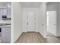 Bright foyer with light wood floors and a white front door, leading to the home's interior at 2909 Annalee Rd, Saint Cloud, FL 34771