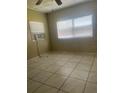 Bedroom with tile floors and window coverings at 4910 Huppel Ave, Orlando, FL 32811