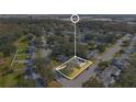 A bird's eye view of the property in a neighborhood filled with mature trees at 3000 Cashmere Dr, Orlando, FL 32827