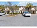 Lovely condo building with well-manicured greenery and ample parking space in a desirable neighborhood at 4891 Clock Tower Dr, Kissimmee, FL 34746