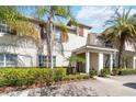 Inviting exterior of a condo with lush landscaping and an attractive entrance at 4891 Clock Tower Dr, Kissimmee, FL 34746