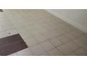 Beige and brown tile floor in a room at 7900 S Orange Blossom Trl # 1120, Orlando, FL 32809