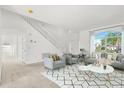 Bright living room with a geometric rug, comfortable seating, and lots of natural light at 1746 Pompano Dr, Poinciana, FL 34759